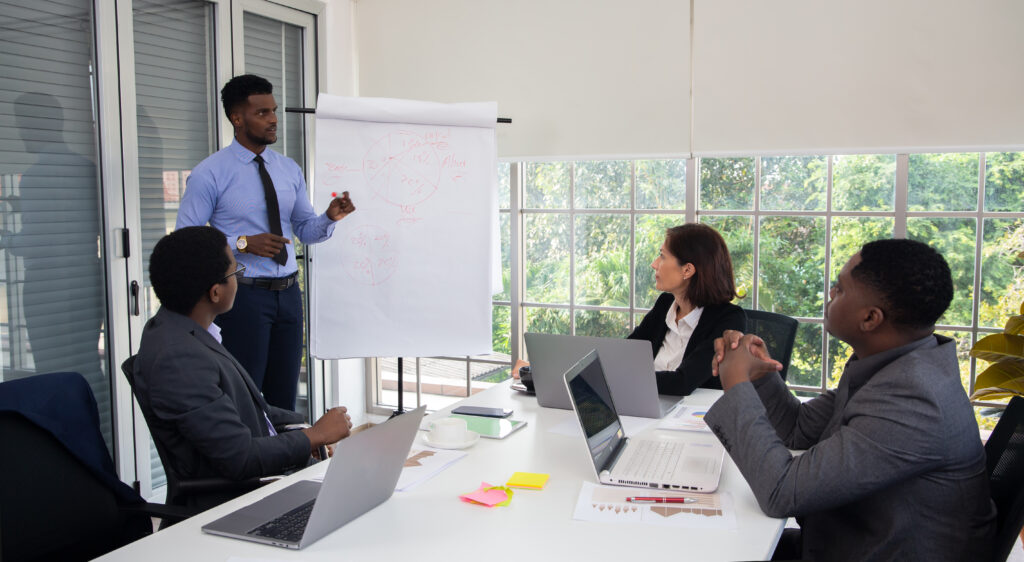 successful businessman coaching people office